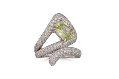 Lot 258 - A YELLOW SAPPHIRE AND DIAMOND RING, of cross...