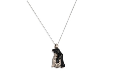 Lot 92 - A DIAMOND AND ONYX PENDANT, modelled as a...