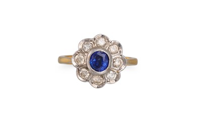 Lot 233 - A SAPPHIRE AND DIAMOND CLUSTER RING, of...