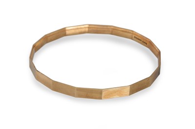 Lot 1 - A 9CT YELLOW GOLD MULTI FACETED BANGLE, 18.8 g.