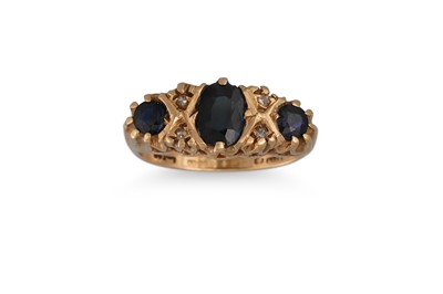 Lot 179 - A SAPPHIRE THREE STONE RING, with diamond...