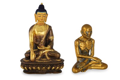 Lot 536 - A GILT AND PATINATED BRONZE FIGURE OF BUDDHA,...