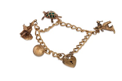 Lot 184 - A 9CT GOLD CHARM BRACELET AND PADLOCK, with...