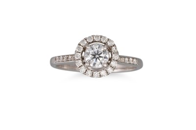 Lot 83 - A DIAMOND 'HALO' CLUSTER RING, the brilliant...