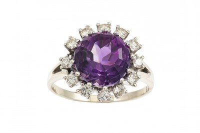 Lot 373 - AN AMETHYST AND DIAMOND CLUSTER RING, the...
