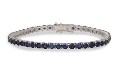 Lot 138 - A SAPPHIRE TENNIS BRACELET, the sapphires...