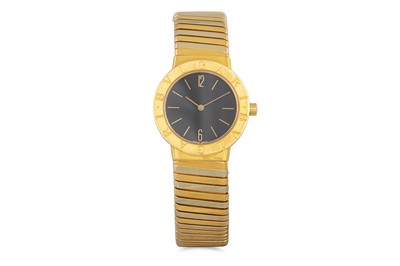 Lot 448 - AN 18CT GOLD BULGARI TUBOGAS WATCH, black dial...