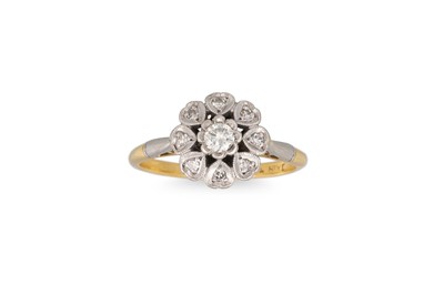 Lot 423 - A VINTAGE DIAMOND DAISY CLUSTER RING, mounted...