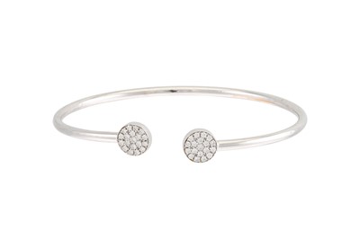 Lot 1 - A DIAMOND SET BANGLE, the open work frame...