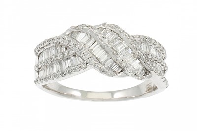Lot 363 - A DIAMOND DRESS RING, of cross over design,...