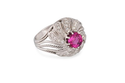 Lot 381 - A RUBY AND DIAMOND RING, of bombé form, the...