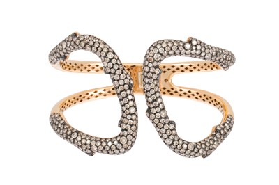 Lot 371 - A DIAMOND BANGLE, hinged design, pave set with...