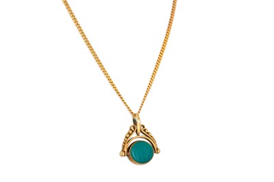 Lot 39 - A GOLD STONE SET SWIVEL SEAL, on a 9ct curb...