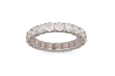 Lot 198 - A DIAMOND ETERNITY RING, the brilliant cut...
