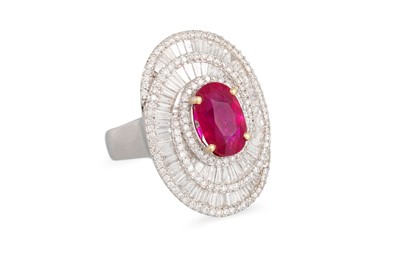 Lot 203 - A DIAMOND AND RUBY CLUSTER RING, the oval ruby...