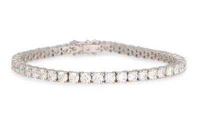 Lot 205 - A DIAMOND LINE BRACELET, the brilliant cut...