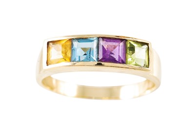 Lot 54 - A STONE SET DRESS RING, set with peridot,...