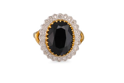 Lot 54 - A DIAMOND AND SAPPHIRE RING, the large oval...