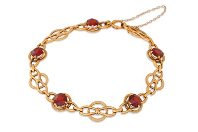 Lot 174 - A VINTAGE 9CT YELLOW GOLD GARNET SET FANCY...