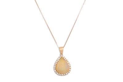 Lot 288 - AN OPAL AND DIAMOND PENDANT, the pear shaped...