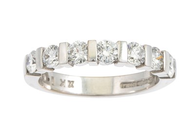 Lot 255 - A DIAMOND HALF ETERNITY RING, the brilliant...