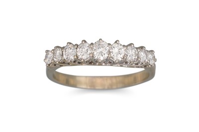 Lot 108 - A NINE STONE DIAMOND RING, the nine round...