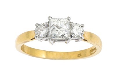 Lot 257 - A THREE STONE DIAMOND RING, set with a...