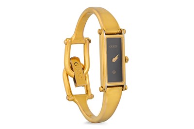 Lot 397 - A LADY'S GUCCI WRISTWATCH, horse bit strap