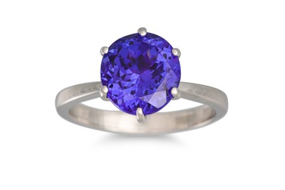 Lot 9 - A TANZANITE RING, the circular tanzanite...