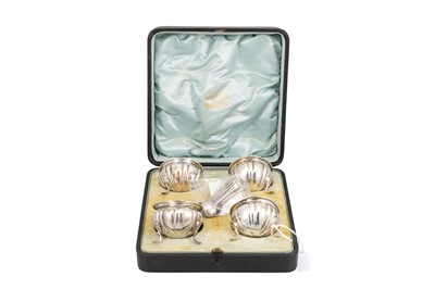 Lot 517 - AN EDWARDIAN CASED FOUR PIECE SILVER CONDIMENT...