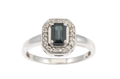 Lot 299 - A SAPPHIRE AND DIAMOND CLUSTER RING, mounted...