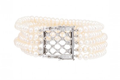 Lot 155 - A FOUR STRANDED PEARL BRACELET, cream tones,...