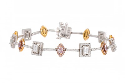 Lot 156 - A PINK AND WHITE DIAMOND BRACELET, of cluster...