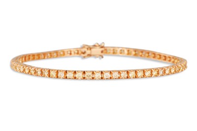 Lot 272 - A DIAMOND LINE BRACELET, set with fancy yellow...