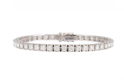 Lot 159 - A DIAMOND LINE BRACELET, the round brilliant...
