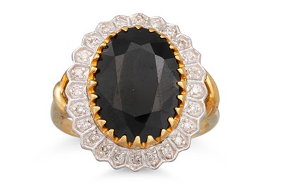Lot 40 - A DIAMOND AND SAPPHIRE CLUSTER RING, the large...
