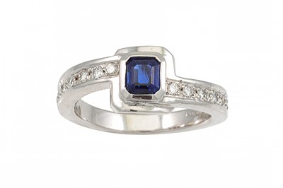 Lot 164 - A SAPPHIRE AND DIAMOND RING, the princess cut...