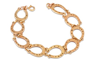 Lot 5 - A 9CT GOLD BRACELET, horse shoe links,12 g.