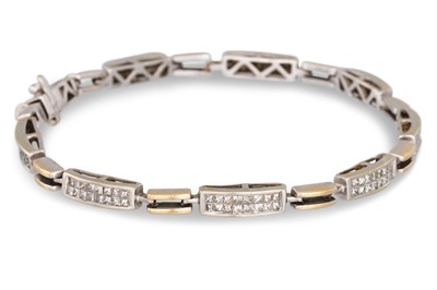 Lot 213 - A DIAMOND BRACELET, channel set with princess...