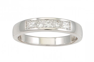 Lot 227 - A DIAMOND HALF ETERNITY RING, the princess cut...