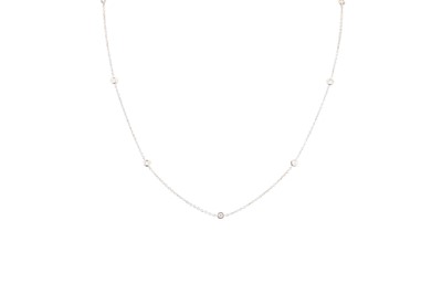 Lot 233 - A DIAMOND SET CHAIN, the collet set brilliant...